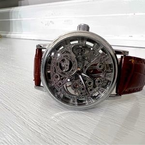 Skeletonized watch with leather band